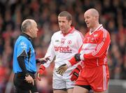 6 February 2011; Referee Martin Duffy speaking to Stephen O'Neill, Tyrone, and Kevin McCloy, Derry. Allianz Football League Division 2 Round 1, Derry v Tyrone, Celtic Park, Derry. Picture credit: Oliver McVeigh  / SPORTSFILE