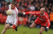 6 February 2011; Stephen O'Neill, Tyrone, in action against Kevin McCloy, Derry. Allianz Football League Division 2 Round 1, Derry v Tyrone, Celtic Park, Derry. Picture credit: Oliver McVeigh  / SPORTSFILE