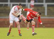 6 February 2011; Sean Cavanagh, Tyrone, in action against PJ McCloskey, Derry. Allianz Football League Division 2 Round 1, Derry v Tyrone, Celtic Park, Derry. Picture credit: Oliver McVeigh  / SPORTSFILE