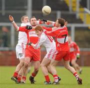 6 February 2011; James Conway, left, and Gerard O'Kane, Derry, in action against Kevin Hughes, left, and Peter Harte, Tyrone. Allianz Football League Division 2 Round 1, Derry v Tyrone, Celtic Park, Derry. Picture credit: Oliver McVeigh  / SPORTSFILE