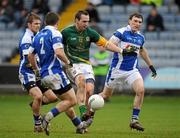 6 February 2011; Graham Reilly, Meath, in action against Gary O'Brien, left, Cormac McGuinness, right, Brian Meade, centre, Laois. Allianz Football League Division 2 Round 1, Laois v Meath, O'Moore Park, Portlaoise. Picture credit: Barry Cregg / SPORTSFILE