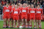 6 February 2011; The Derry team stand for the National Anthem. Allianz Football League Division 2 Round 1, Derry v Tyrone, Celtic Park, Derry. Picture credit: Oliver McVeigh  / SPORTSFILE