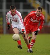 6 February 2011; Brian McGuigan, Tyrone, in action against Barry McGoldrick, Derry. Allianz Football League Division 2 Round 1, Derry v Tyrone, Celtic Park, Derry. Picture credit: Oliver McVeigh  / SPORTSFILE