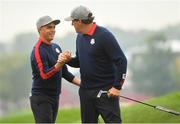 30 September 2016; Phil Mickelson congratulates teammate Rickie Fowler of USA after putting to win the 9th hole during the morning Foursomes Matches against Rory McIlroy and Andy Sullivan of Europe at The 2016 Ryder Cup Matches at the Hazeltine National Golf Club in Chaska, Minnesota, USA. Photo by Ramsey Cardy/Sportsfile