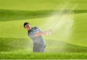 30 September 2016 Rory McIlroy of Europe plays out of the bunker on the 6th during the afternoon Fourball Match against Dustin Johnson and Matt Kuchar of USA at The 2016 Ryder Cup Matches at the Hazeltine National Golf Club in Chaska, Minnesota, USA. Photo by Ramsey Cardy/Sportsfile
