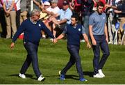 30 September 2016 Europe team captain Darren Clarke, left, in conversation with Rory McIlroy, centre, and Thomas Pieters of Europe on the 8th hole during the afternoon Fourball Match against Dustin Johnson and Matt Kuchar of USA at The 2016 Ryder Cup Matches at the Hazeltine National Golf Club in Chaska, Minnesota, USA. Photo by Ramsey Cardy/Sportsfile
