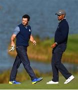 30 September 2016 Rory McIlroy of Europe and USA vice-captain Tiger Woods on the 9th during the afternoon Fourball Match against Dustin Johnson and Matt Kuchar of USA at The 2016 Ryder Cup Matches at the Hazeltine National Golf Club in Chaska, Minnesota, USA. Photo by Ramsey Cardy/Sportsfile