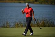 30 September 2016; Dustin Johnson of USA celebrates a putt on the 10th during the afternoon Fourball Match against Thomas Pieters and Rory McIlroy of Europe at The 2016 Ryder Cup Matches at the Hazeltine National Golf Club in Chaska, Minnesota, USA. Photo by Ramsey Cardy/Sportsfile