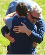 30 September 2016; Rory McIlroy of Europe and Team captain Darren Clarke after the afternoon Fourball Match against Dustin Johnson and Matt Kuchar of USA at The 2016 Ryder Cup Matches at the Hazeltine National Golf Club in Chaska, Minnesota, USA. Photo by Ramsey Cardy/Sportsfile
