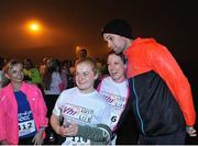 30 September 2016; Niall 'Bressie' Breslin poses for photos with participants ahead of the Vhi A Lust for Life run series night run in Cork Airport. The run, in conjunction with the Irish Independent, saw runners, walkers and joggers of all levels lace up their running shoes, ignoring the late hour and complete the 5km night run along the Cork Airport runway. Funds raised go towards the Cork City Children’s Hospital Club, local athletics clubs in the area and A Lust for Life.  For further details, please see www.alustforlife.com.  Photo by David Fitzgerald/Sportsfile