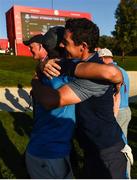 30 September 2016; Niall Horan congratulates Rory McIlroy of Europe after winning his Fourball Match on the 16th hole against Dustin Johnson and Matt Kuchar of USA at The 2016 Ryder Cup Matches at the Hazeltine National Golf Club in Chaska, Minnesota, USA. Photo by Ramsey Cardy/Sportsfile