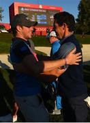 30 September 2016; Niall Horan congratulates Rory McIlroy of Europe after winning his Fourball Match on the 16th hole against Dustin Johnson and Matt Kuchar of USA at The 2016 Ryder Cup Matches at the Hazeltine National Golf Club in Chaska, Minnesota, USA. Photo by Ramsey Cardy/Sportsfile