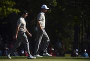 1 October 2016; Rory McIlroy and Thomas Pieters of Europe walk up the fairway during the morning Foursome Match against Rickie Fowler and Phil Mickelson of USA at The 2016 Ryder Cup Matches at the Hazeltine National Golf Club in Chaska, Minnesota, USA. Photo by Ramsey Cardy/Sportsfile
