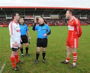 6 February 2011; Referee Martin Duffy tosses the coin in front of Tyrone captain Ryan McMenamin, left, and Derry captain Barry McGoldrick before the game. Allianz Football League Division 2 Round 1, Derry v Tyrone, Celtic Park, Derry. Picture credit: Oliver McVeigh  / SPORTSFILE
