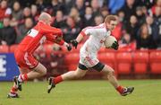 6 February 2011; Aidan Cassidy, Tyrone, in action against Kevin McCloy, Derry. Allianz Football League Division 2 Round 1, Derry v Tyrone, Celtic Park, Derry. Picture credit: Oliver McVeigh  / SPORTSFILE