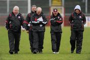 6 February 2011; Tyrone manager Mickey Harte, second from right, walks off the pitch accompanied by his management team, from left, Jim Curran, Tom Heron, Tony Donnelly, assistant manager, and Peter Quinlivan after the game. Allianz Football League Division 2 Round 1, Derry v Tyrone, Celtic Park, Derry. Picture credit: Oliver McVeigh  / SPORTSFILE