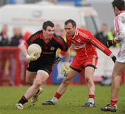 6 February 2011; Jonathan Curran, Tyrone, in action against Paddy Bradley, Derry. Allianz Football League Division 2 Round 1, Derry v Tyrone, Celtic Park, Derry. Picture credit: Oliver McVeigh  / SPORTSFILE