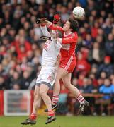6 February 2011; Dermot McBride, Derry, and Stephen O'Neill, Tyrone, contest a high ball. Allianz Football League Division 2 Round 1, Derry v Tyrone, Celtic Park, Derry. Picture credit: Oliver McVeigh  / SPORTSFILE