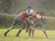 7 February 2011; Conor Pearse, Presentation College Bray, is tackled by Diarmuid O'hUllachain and James McCusker, 12, CUS. Fr Godfrey Cup Quarter-Final Replay, CUS v Presentation College Bray, St. Columba’s College, Whitechurch, Dublin. Picture credit: Stephen McCarthy / SPORTSFILE