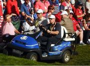1 October 2016; Europe vice-captain Padraig Harrington, left, and buisnessman JP McManus, back, during the afternoon Fourball Matches at The 2016 Ryder Cup Matches at the Hazeltine National Golf Club in Chaska, Minnesota, USA. Photo by Ramsey Cardy/Sportsfile