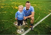 1 October 2016; Denis Bastick of Dublin and son Adian, 1, celebrate with the Sam Maguire Cup after  the GAA Football All-Ireland Senior Championship Final Replay match between Dublin and Mayo at Croke Park in Dublin. Photo by Sam Barnes/Sportsfile