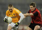 19 January 2011; Paddy Cunningham, Antrim, in action against Kevin Duffin, Down. Barrett Sports Lighting Dr. McKenna Cup, Section C, Antrim v Down, Casement Park, Belfast, Co. Antrim. Picture credit: Oliver McVeigh / SPORTSFILE