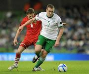 8 February 2011; Richard Dunne, Republic of Ireland, in action against Andy King, Wales. Carling Four Nations Tournament, Republic of Ireland v Wales, Aviva Stadium, Lansdowne Road, Dublin. Picture credit: Barry Cregg / SPORTSFILE