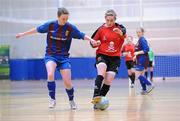 29 January 2011; Yvonne Cahill, UCC, in action against Karen Duggan, UL. Womens Soccer Colleges Association of Ireland National Futsal Finals, University of Limerick, Limerick. Picture credit: Diarmuid Greene / SPORTSFILE