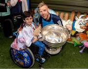 2 October 2016; Hassan Benhaffaf, age 6, one of the Benhaffaf twins from Carrigtwohill in Cork, with Jonny Cooper and the Sam Maguire cup during the Dublin team's visit to the Our Lady's Children's Hospital in Crumlin, Dublin.  Photo by Piaras Ó Mídheach/Sportsfile