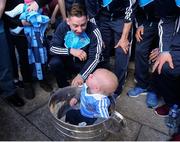 2 October 2016; Tomás O'Broin, 11 months old, from Inchicore, with Philly McMahon and the Sam Maguire cup during the Dublin team's visit to the Our Lady's Children's Hospital in Crumlin, Dublin.  Photo by Piaras Ó Mídheach/Sportsfile