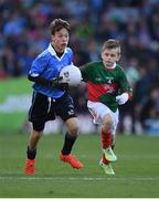 1 October 2016; Alex Drycher, Bayside NS, Sutton, Dublin, in action against Oisín Cronin, Craggagh NS, Kiltimagh, Mayo, during the INTO Cumann na mBunscol GAA Respect Exhibition Go Games at the GAA Football All-Ireland Senior Championship Final Replay match between Dublin and Mayo at Croke Park in Dublin. Photo by Ray McManus/Sportsfile