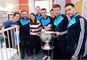 2 October 2016; Dublin manager Jim Gavin, and a selection of players with Eva Maher, 10 Weeks Old, and her parents Paul Maher, and Kiera Watson, from Swords, Co Dublin with the Sam Maguire cup during their visit to the Temple Street Children's Hospital in Dublin.  Photo by Sam Barnes/Sportsfile