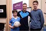 2 October 2016; Jonny Cooper of Dublin with James Power, 9, and Conor Power, 16, from Sandymount, Co Dublin during their visit to the Temple Street Children's Hospital in Dublin.  Photo by Sam Barnes/Sportsfile