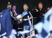 2 October 2016; Jonny Cooper of Dublin brings the Delaney cup onto the stage during the All-Ireland Champions Homecoming at Smithfield Square in Dublin. Photo by Sam Barnes/Sportsfile