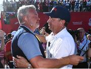 2 October 2016; Europe team captain Darren Clarke, left, and USA captain Davis Love III embrace following the USA victory at The 2016 Ryder Cup Matches at the Hazeltine National Golf Club in Chaska, Minnesota, USA. Photo by Ramsey Cardy/Sportsfile