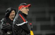9 February 2011; Tyrone manager Mickey Harte watches on from the sideline. Barrett Sports Lighting Dr. McKenna Cup Semi-Final, Tyrone v Cavan, Brewster Park, Enniskillen, Co. Fermanagh. Picture credit: Oliver McVeigh / SPORTSFILE
