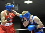11 February 2011; Shane Murtagh, left, Crumlin Boxing Club, left, exchanges punches with Jonathan Dowling, Paulstown Boxing Club, during their 69kg division bout. National Boxing Championships, Preliminaries, National Stadium, Dublin. Picture credit: David Maher / SPORTSFILE