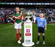 1 October 2016; Maya Dunne, Holy Family NS, Swords, Co. Dublin, and Michael Casey, St Mary’s NS, Lucan Co. Dublin, bring the Sam Maguire Cup to the pitch ahead of the GAA Football All-Ireland Senior Championship Final Replay match between Dublin and Mayo at Croke Park in Dublin. Photo by Stephen McCarthy/Sportsfile