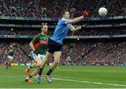 1 October 2016; Dean Rock of Dublin scores a point despite the efforts of Keith Higgins of Mayo during the GAA Football All-Ireland Senior Championship Final Replay match between Dublin and Mayo at Croke Park in Dublin. Photo by Piaras Ó Mídheach/Sportsfile