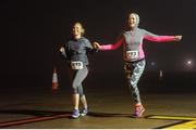 1 October 2016; Jane Cronin and Karen Murphy during the Vhi A Lust for Life run series night run in Cork Airport. The run, in conjunction with the Irish Independent, saw runners, walkers and joggers of all levels lace up their running shoes, ignoring the late hour and complete the 5km night run along the Cork Airport runway. Funds raised go towards the Cork City Children’s Hospital Club, local athletics clubs in the area and A Lust for Life.  For further details, please see www.alustforlife.com.  Photo by Tomas Greally/Sportsfile