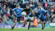 1 October 2016; Dylan McEvoy, Buffers Alley GAA, Wexford, representing Mayo, in action against Harry Gormley, Garristown GAA, Fingal, Dublin, left and Cormac Dignam, St Vincent's GAA, Marino, Dublin, right, during the INTO Cumann na mBunscol GAA Respect Exhibition Go Games at the GAA Football All-Ireland Senior Championship Final Replay match between Dublin and Mayo at Croke Park in Dublin. Photo by Eóin Noonan/Sportsfile