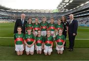 1 October 2016; Mini-Sevens Coordinator Gerry O'Meara, Uachtarán Chumann Lúthchleas Gaeil Aogán Ó Fearghail, with the Mayo team, back row, Emma Murray, Fahy NS, Newport, Mayo, Grace Naughton, Currabaggan NS, Knockmore, Mayo, Grace Shannon, Melview National School, Longford, Nikita Tighe, St Joseph's NS, Bekan, Mayo, Deirbhile Horkan, Meelickmore NS, Claremorris, Mayo, front row, left to right, Kevina Walsh, St Attracta's NS, Charlestown, Mayo, Amy Forkan, St Joseph's NS, Midfield, Mayo, Muireann Cogan, St Angela's NS, Castlebar, Mayo, Molly McManamon, Drumgallagh NS, Ballycroy, Mayo, Chloe McDonnell, Binghamstown NS, Belmullet, Mayo, ahead of the GAA Football All-Ireland Senior Championship Final Replay match between Dublin and Mayo at Croke Park in Dublin. Photo by Daire Brennan/Sportsfile