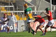 13 February 2011; Colin Egan, Offaly, beats Cork players left to right, Anthony Nash, goalkeeper, Eoin Cadogan and Jerry O'Connor, to score his side's first goal. Allianz Hurling League, Division 1, Round 1, Cork v Offaly, Pairc Uí Chaoimh, Cork. Picture credit: David Maher / SPORTSFILE