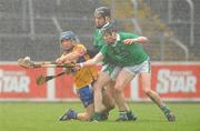 13 February 2011; Conor McGrath, Clare, in action against Wayne McNamara, right, and Richie McCarthy, Limerick. Allianz Hurling League, Division 2, Round 1, Clare v Limerick, Cusack Park, Ennis, Co. Clare. Picture credit: Diarmuid Greene / SPORTSFILE