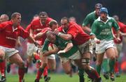 13 October 2001; Peter Clohessy, Ireland, is tackled by Chris Wyatt, Wales. Lloyds TSB Six Nations Championship, Millenniun Stadium, Cardiff, Wales. Rugby. Picture credit; Matt Browne / SPORTSFILE *EDI*