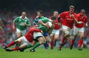 13 October 2001; Brian O'Driscoll, Ireland, is tackled by Rob Howley, Wales. Lloyds TSB Six Nations Championship, Millenniun Stadium, Cardiff, Wales. Rugby. Picture credit; Matt Browne / SPORTSFILE *EDI*
