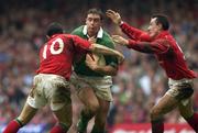 13 October 2001; David Wallace, Ireland, is tackled by Stephen Jones, left, and Rob Howley, Wales. Wales v Ireland, Lloyds TSB Six Nations Championship, Millennium Stadium, Cardiff, Wales. Rugby. Picture credit; Brendan Moran / SPORTSFILE *EDI*