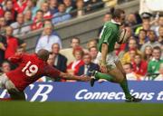13 October 2001; Ireland's Denis Hickie gets past the tackle of Gavin Thomas, Wales on his way to scoring a try. Wales v Ireland, Lloyds TSB Six Nations Championship, Millennium Stadium, Cardiff, Wales. Rugby. Picture credit; Brendan Moran / SPORTSFILE *EDI*