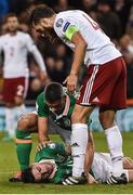 6 October 2016; Jonathan Walters tends to team mate Robbie Brady after he clashed heads with Solomon Kverkvelia of Georgia during the FIFA World Cup Group D Qualifier match between Republic of Ireland and Georgia at Aviva Stadium, Lansdowne Road in Dublin. Photo by David Maher/Sportsfile
