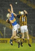 12 February 2011; Brendan Maher, Tipperary, contests a high ball with Michael Fennelly, 11, and John Mulhall, Kilkenny. Allianz Hurling League, Division 1, Round 1, Tipperary v Kilkenny, Semple Stadium, Thurles, Co. Tipperary. Picture credit: Brendan Moran / SPORTSFILE
